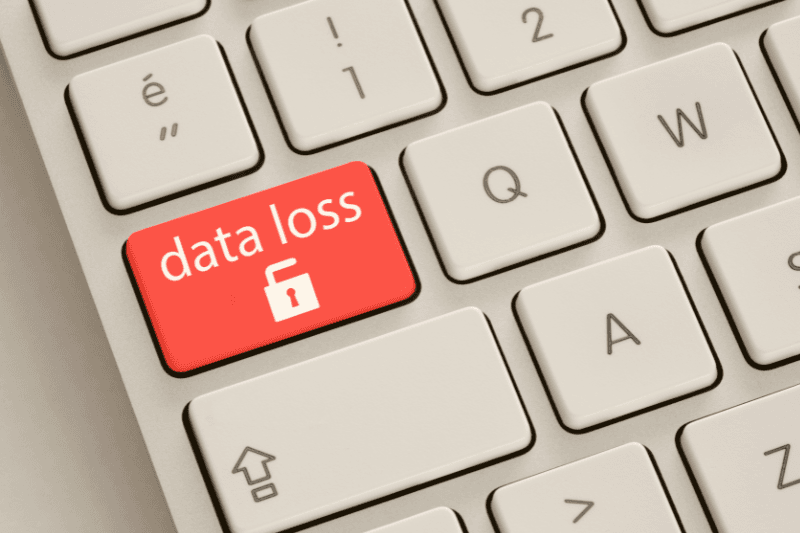 Red “data loss” key with an open padlock icon on a keyboard